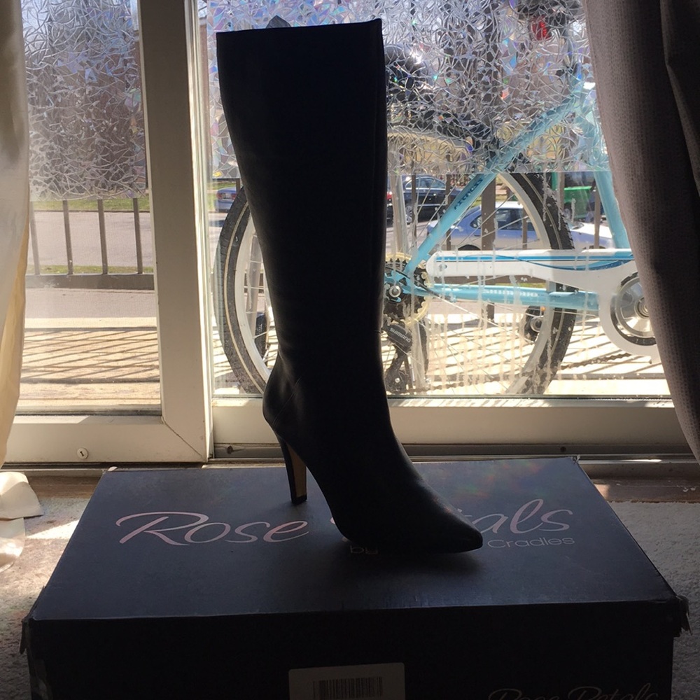 Wide, black knee-high boots with 3-inch heel